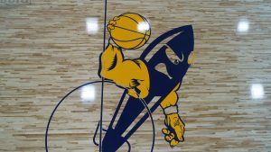 gym floor with rocket mascot painted in center