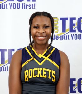 Young black girl in cheer uniform