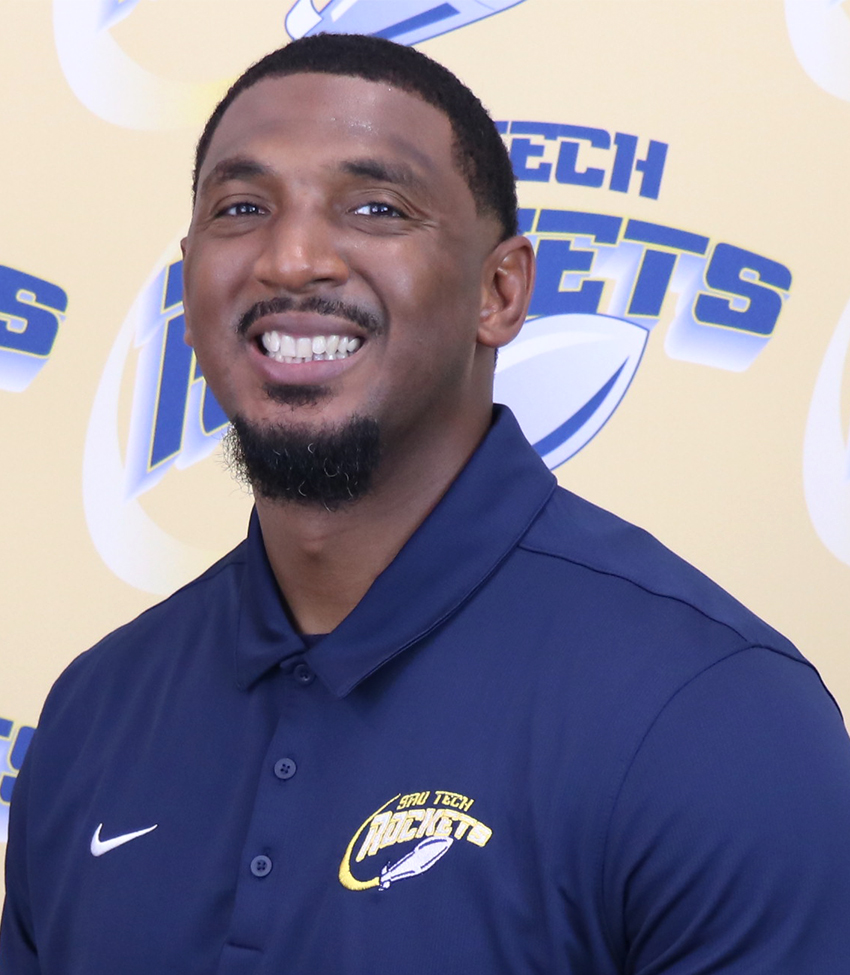 Smiling African American male in blue polo shirt