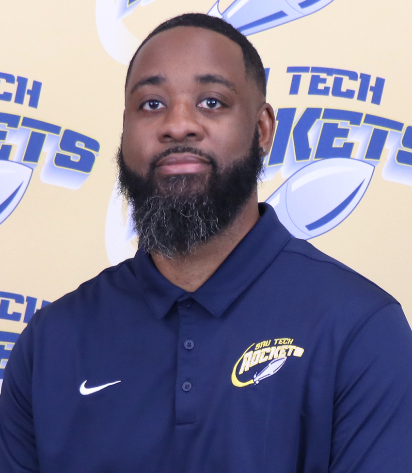 African American male in blue polo shirt with beard