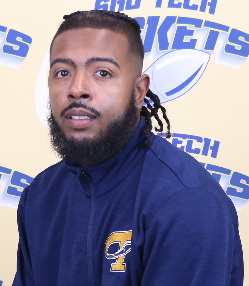 African American male in blue zip up jacket