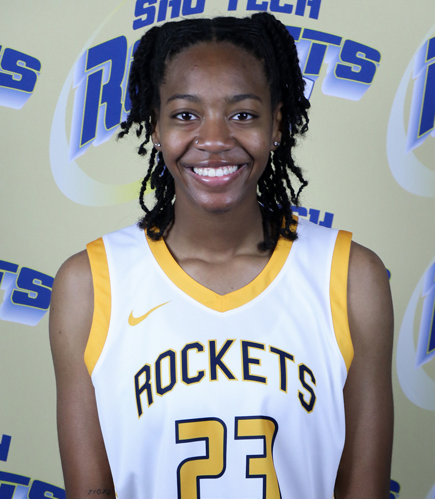 Young African American Woman in White Jersey Number 23