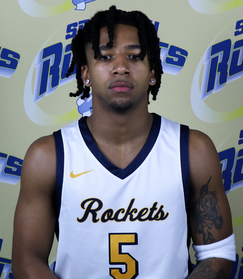 Young African American Man in White Jersey Number 5