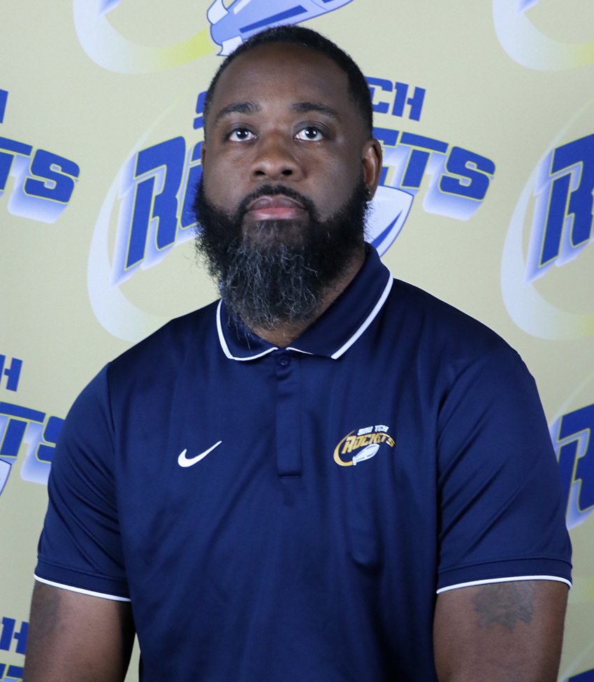 Men's Basketball Assistant Coach in a blue polo