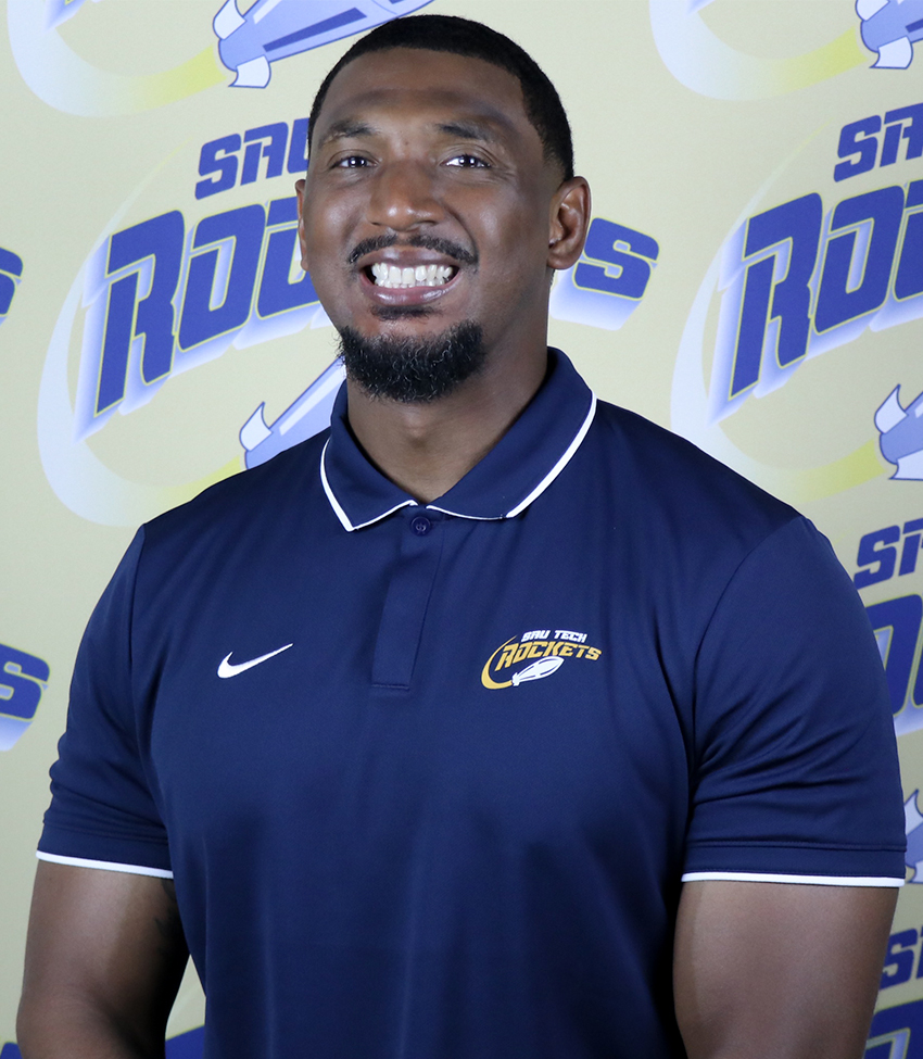 Mens Basketball Head Coach in a blue polo