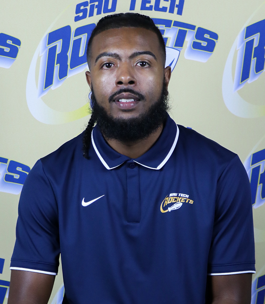 Men's Basketball Assistant Coach in a blue polo